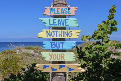 pink teal yellow multi color please leave nothing but your feet road signage
