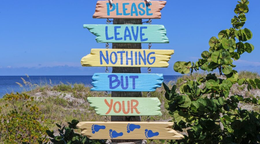 pink teal yellow multi color please leave nothing but your feet road signage